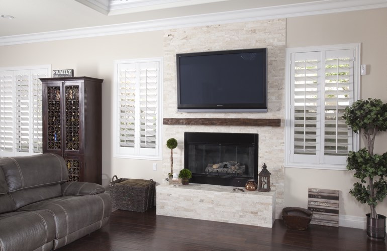 White plantation shutters in a Boise living room with solid hardwood floors.